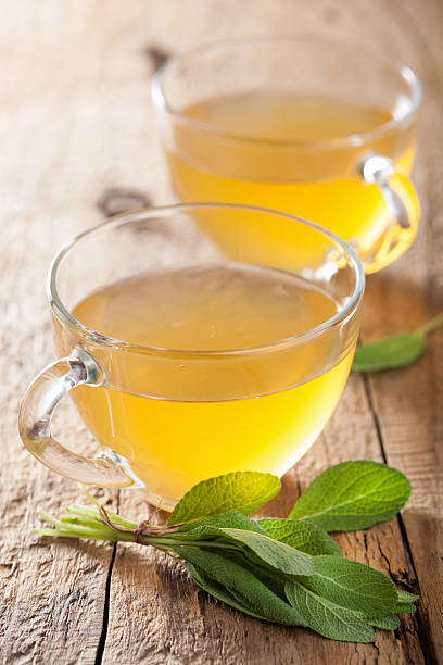herbal sage tea with green leaf in glass cups