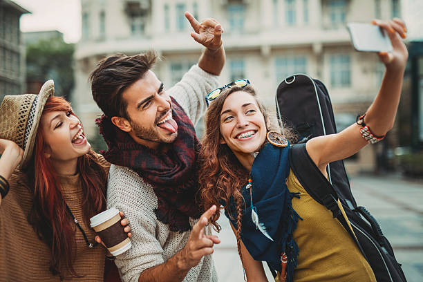 istock Young people having fun and making selfie 523540605
