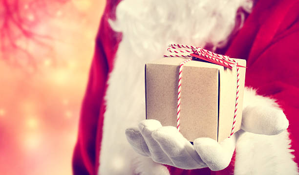 istock Santa Claus giving a gift 523540643