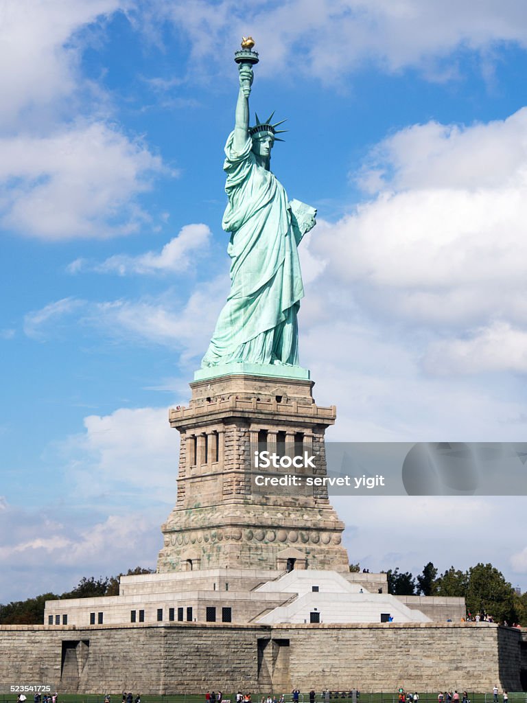 Statue Of Liberty With Skyline Blue Stock Photo