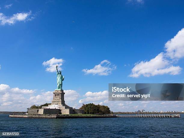 Statue Of Liberty With Skyline Stock Photo - Download Image Now - Blue, Book, Cloud - Sky