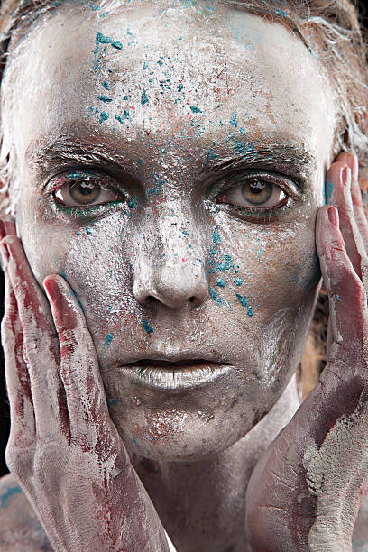 istock woman silver statue in liquid metal posing 523542063