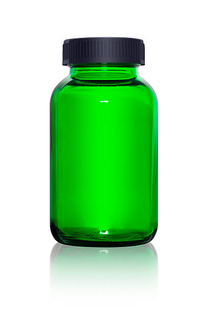 istock Blank glass supplement bottle isolated on white background 523558535
