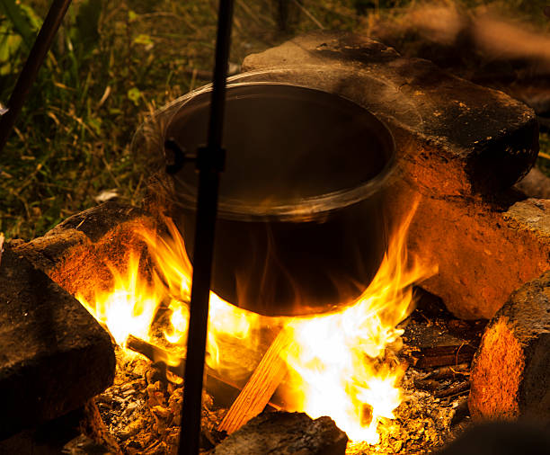 istock Cooking on a fire in field conditions, 523558839