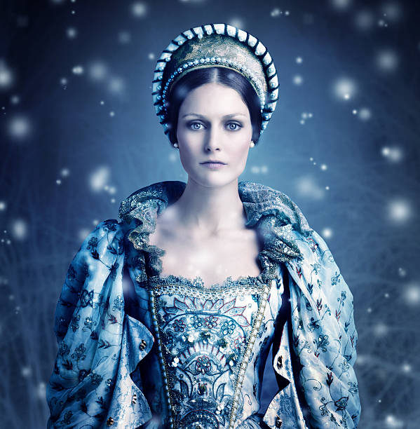 Here comes winter Portrait of a evil-looking queen with snow falling around her queen royal person stock pictures, royalty-free photos & images