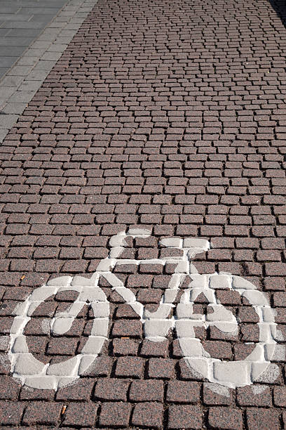 istock Bike Symbol on Cobbled Stone 523560391