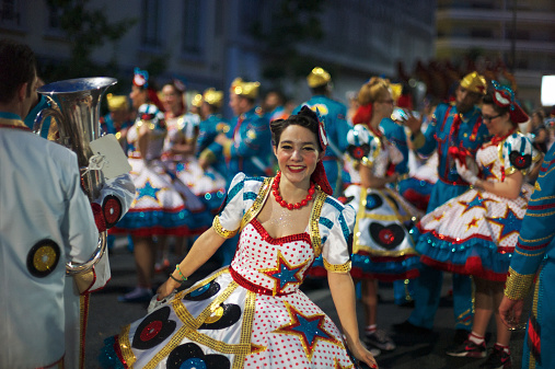 Matamoros, Tamaulipas, Mexico - November 1, 2022: Dia de los Muertos Parade, young women carry frames with flowers, dress up as catrinas