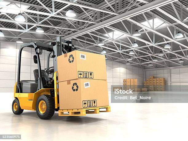 Forklift Truck In Warehouse Or Storage Loading Cardboard Boxes Stock Photo - Download Image Now