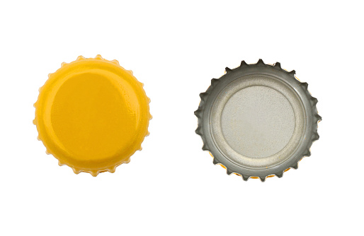 Both sides of a yellow metal bottle cap