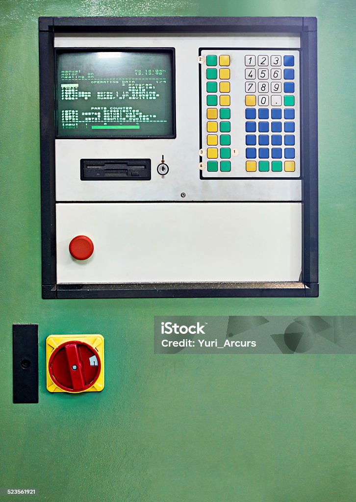 It's an oldie but a goodie Closeup shot of a control panel on a piece of factory machinery Button - Sewing Item Stock Photo