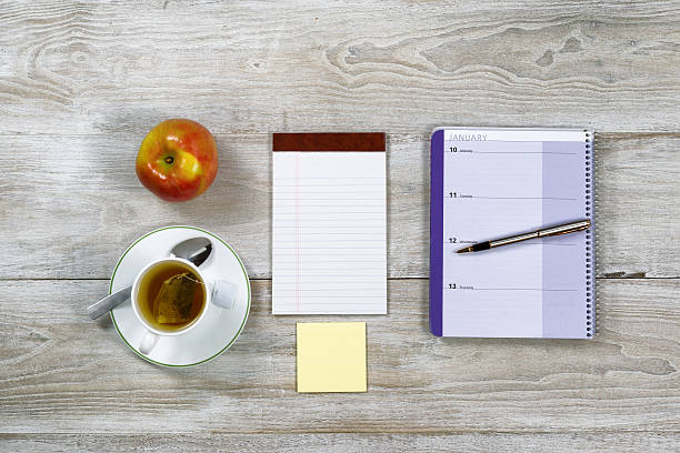 istock Wooden Desktop with Business Objects and snack food 523563571