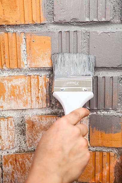 istock Orange brick wall painted with grey color 523563679