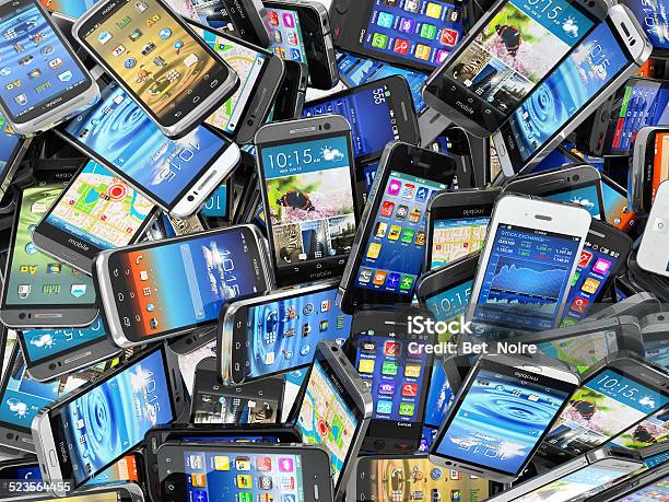 Mobile Phones Background Pile Of Different Modern Smartphones Stock Photo - Download Image Now