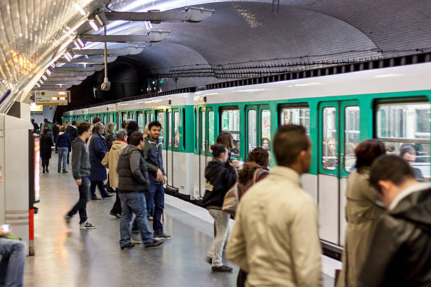 Paris, France - April 27, 2013:Travellers on Parisian Metro station (name:Mirabeau) in Paris. Paris Metro is the 2nd largest underground system worldwide by number of stations (300).