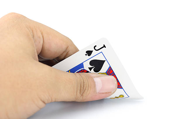 istock jack of spades in hand 523577149