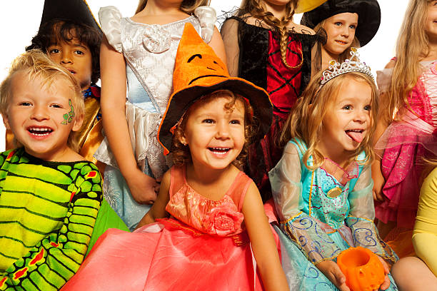 istock Many happy kids in Halloween costumes 523577257