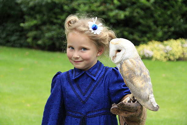 istock Cheecky girl with owl 523577273
