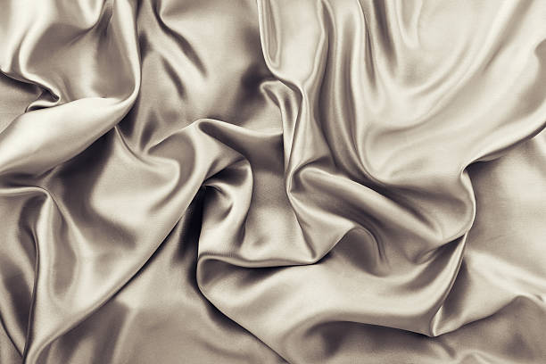 istock Golden brown rumple satin fabric 523577355