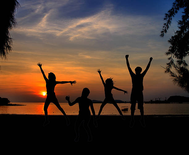 istock Silhouette of Young People Jumping 523577621