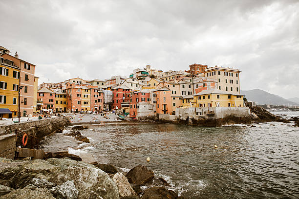Genoa, Italy - November 10, 2018: Genoa cityscape in early morning fog and rain. View from the sea.