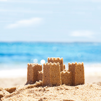 Sand Castle on Beach with background ocean