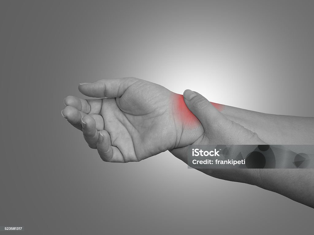 Woman with wrist pain Acute pain in a woman wrist Adult Stock Photo