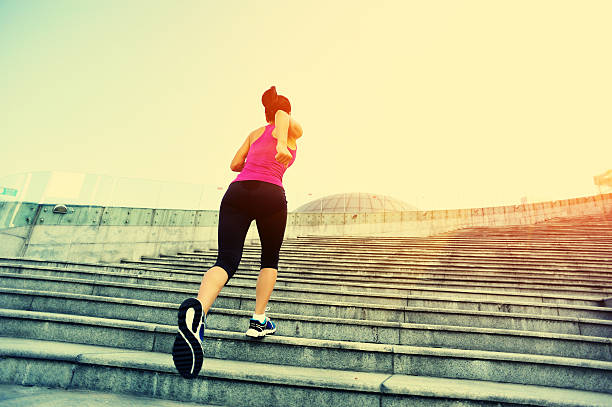 istock Runner athlete running on stairs. 523581769