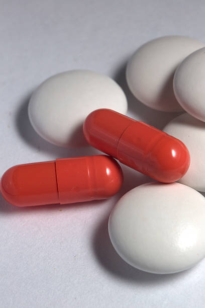 istock tablets capsules pills lying on white background red and white 523582051