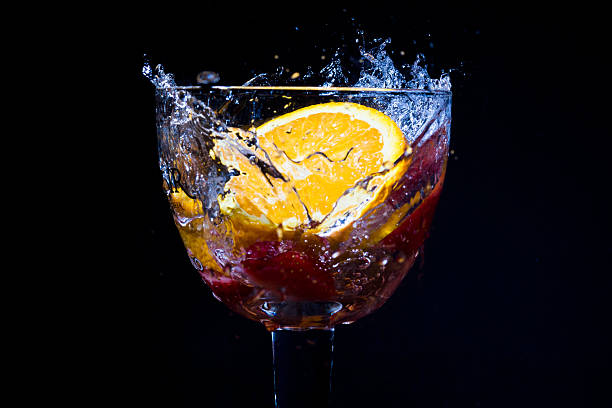 istock Strawberry splash in to a glass with orange 523583969