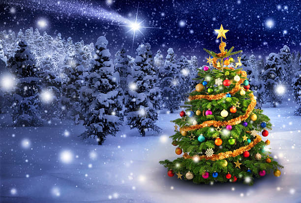 istock Christmas tree in snowy night 523584255