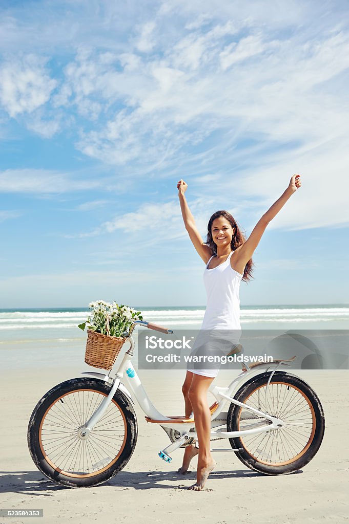 bike beach babe woman riding bicycle on beach in summer Arms Raised Stock Photo