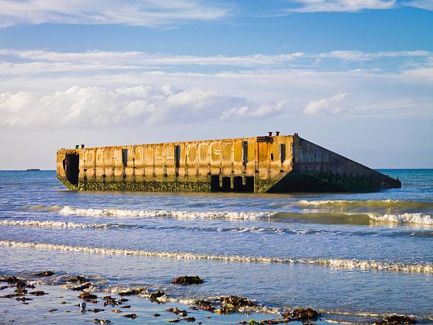 Remains of the artificial Mulberry Harbour at Arromanches, France stock photo