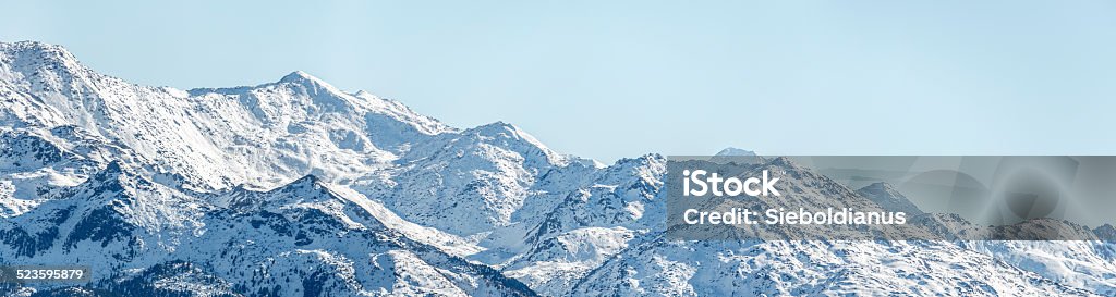 Alpine snowy mountain peaks around Innsbruck. Blue Stock Photo
