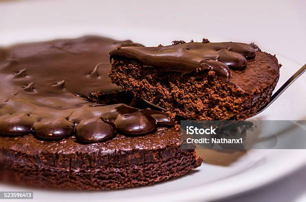 Slice Of Chocolate Fudge Cake On A White Plate Stock Photo - Download Image Now - Baked, Cake, Chocolate