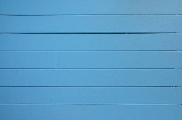 Parede azul com desenho de riscas como fundo - fotografia de stock