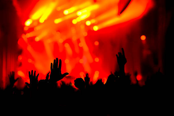 istock Silhouette of crowd on concert 523598633