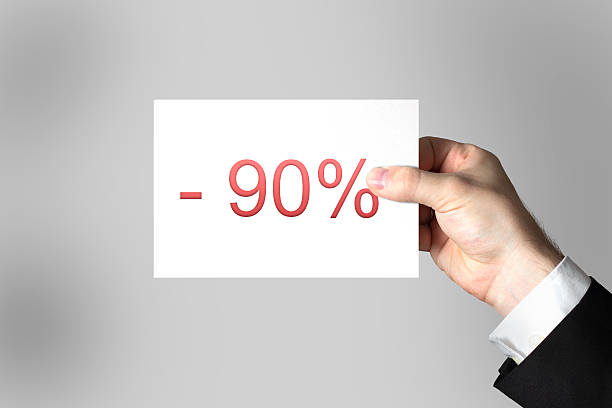 hand holding card label ninety percent off
