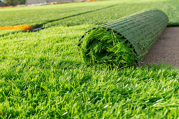 verde erba artificiale - finto foto e immagini stock