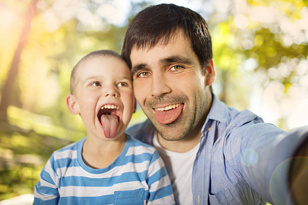 istock Father and son taking selfie in nature 523601365
