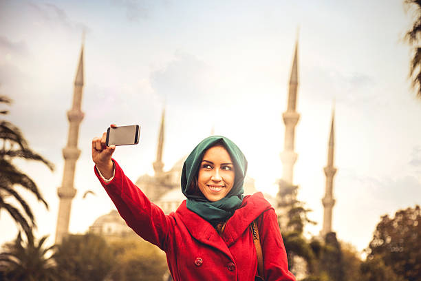 istock Woman taking a selfie in front of a mosque 523613709