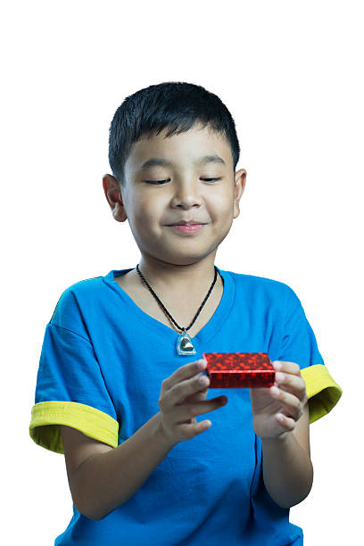 istock Asian kid smile receive Christmas gift 523613723