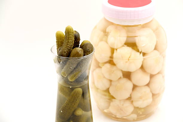 istock Pickled cucumber in glass jar isolated 523614711
