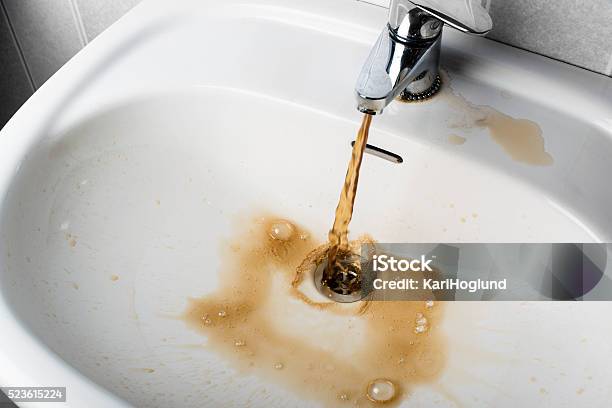 Dirty Brown Water Running Into A Sink Stock Photo - Download Image Now - Water, Dirty, Unhygienic