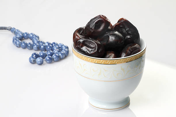 istock Ramadan fresh dates in a white bowl with rosary 523615942