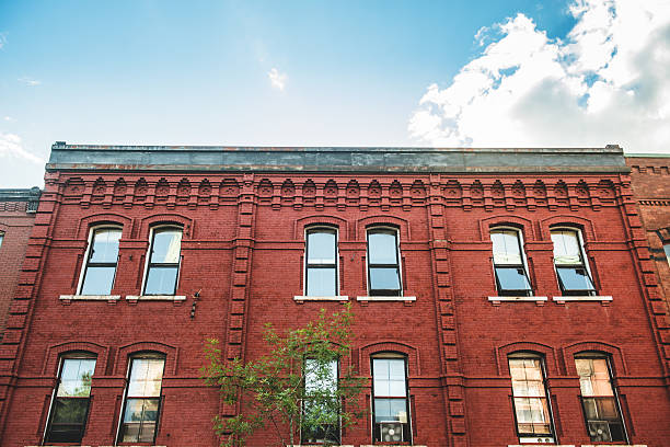 Toronto, Canada - September 13, 2021:  Facade of the type of ornate brick main street commercial building common in the 1800s, with stores on the ground floor and apartments above