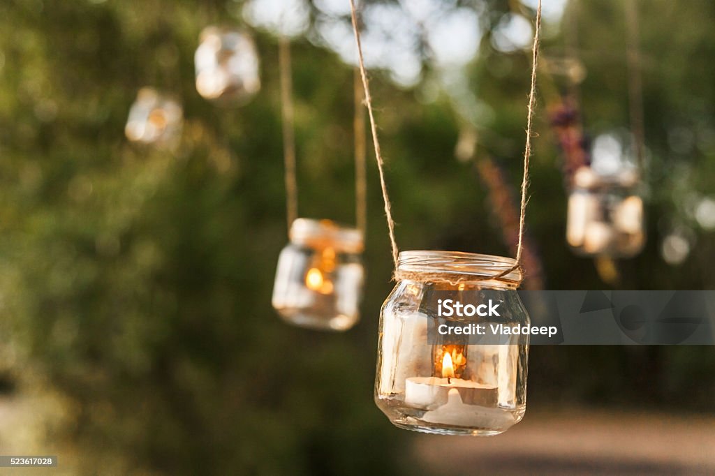 mason jar candle hanging on tree for wedding decor Wedding Stock Photo