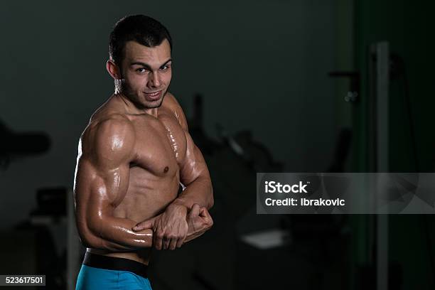 Bodybuilder Performing Side Chest Poses Stock Photo - Download Image Now - Active Lifestyle, Adult, Adults Only