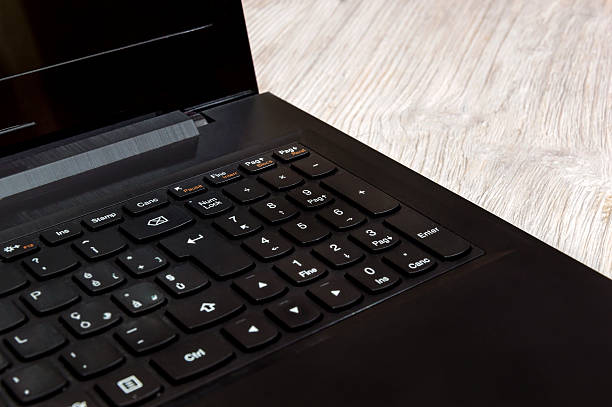 istock Laptop on the wooden background 523618290