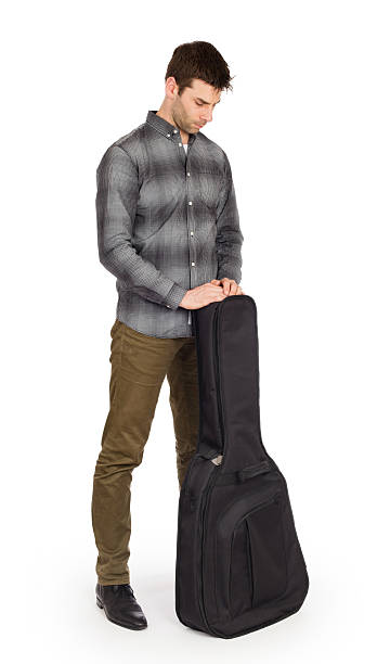 istock Musican with acoustic guitar in bag 523618420