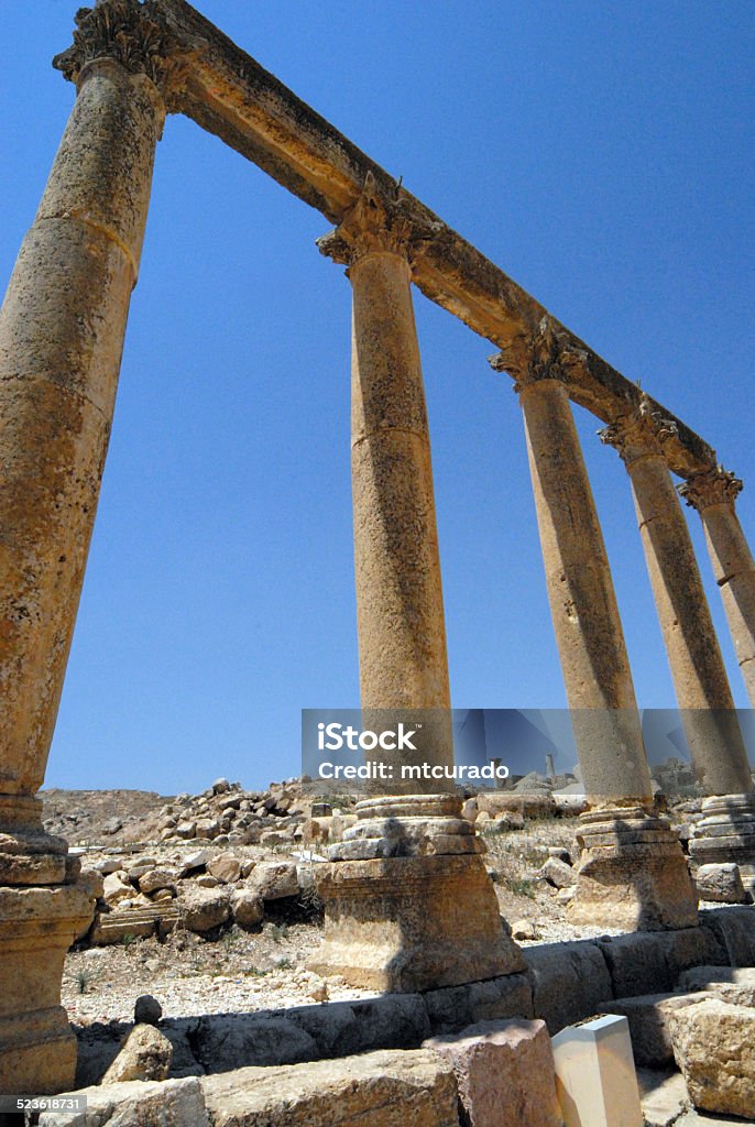 Jerash, Jordan: the Cardo Maximus Jerash, Jordan: the Cardo Maximus, the main north–south-oriented street - Roman city of Gerasa - remains of the corinthian colonnade against the sky - photo by M.Torres Ancient Stock Photo